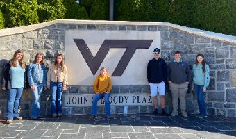  FFA Officers stand in front of Virginia Tech sign